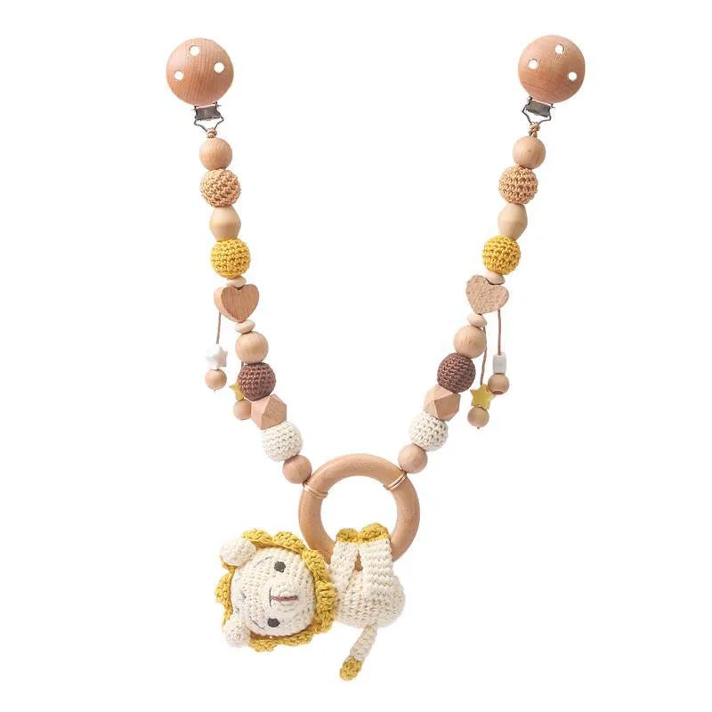 Baby crib hanging bunny music toy with metal construction in cart chain rabbit colour, showing biteable pendant for infant soothing and development.