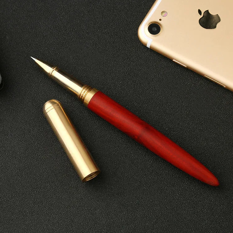 Brass and solid wood signature pen showing wood grain and metal details