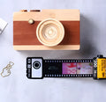 Memory film album with wooden boxes in yellow, pink and blue colours including tote bag