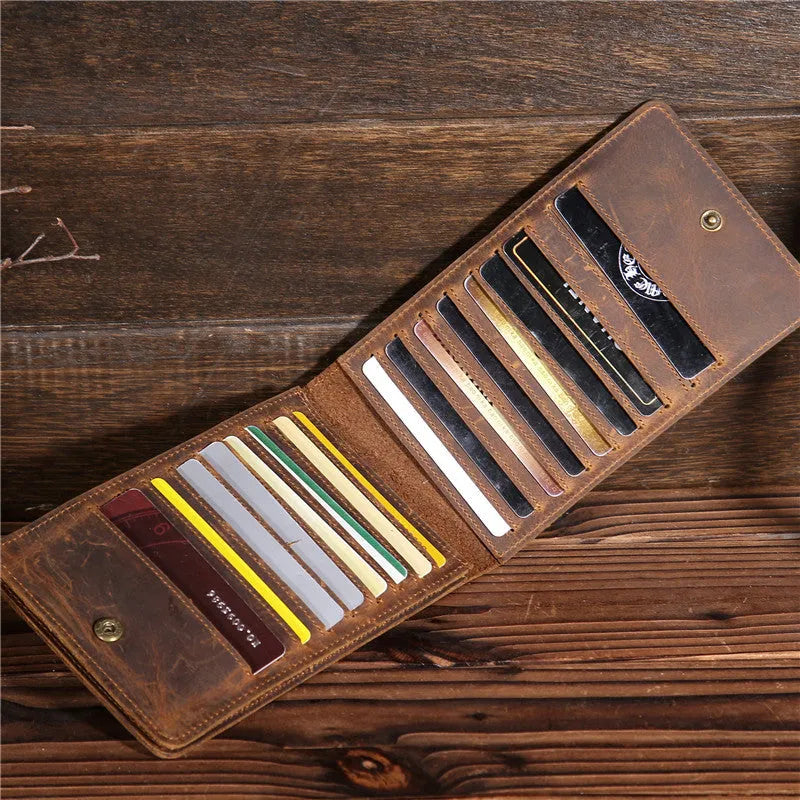 Men's black cowhide leather card holder wallet open to show 18 card slots, money pocket, and phone pocket.
