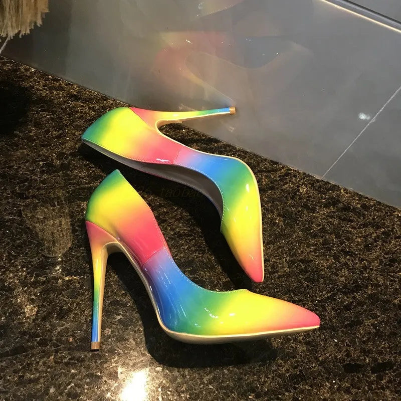 Rainbow patent leather pointed toe stiletto high heel shoe with thin heel.