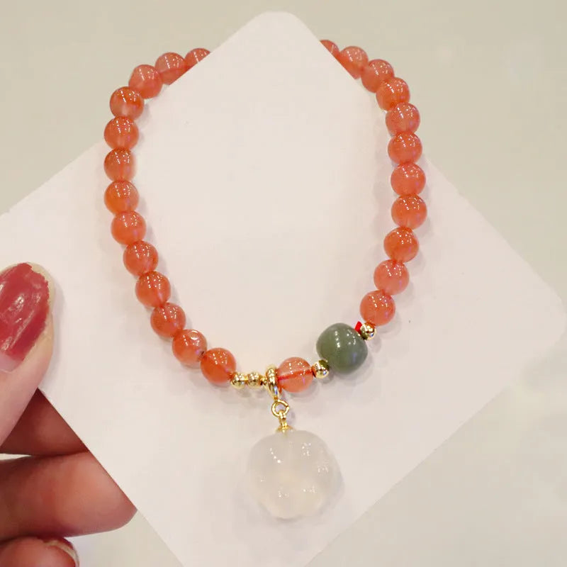 Natural red agate bracelet with cat paw design and jade accent stones