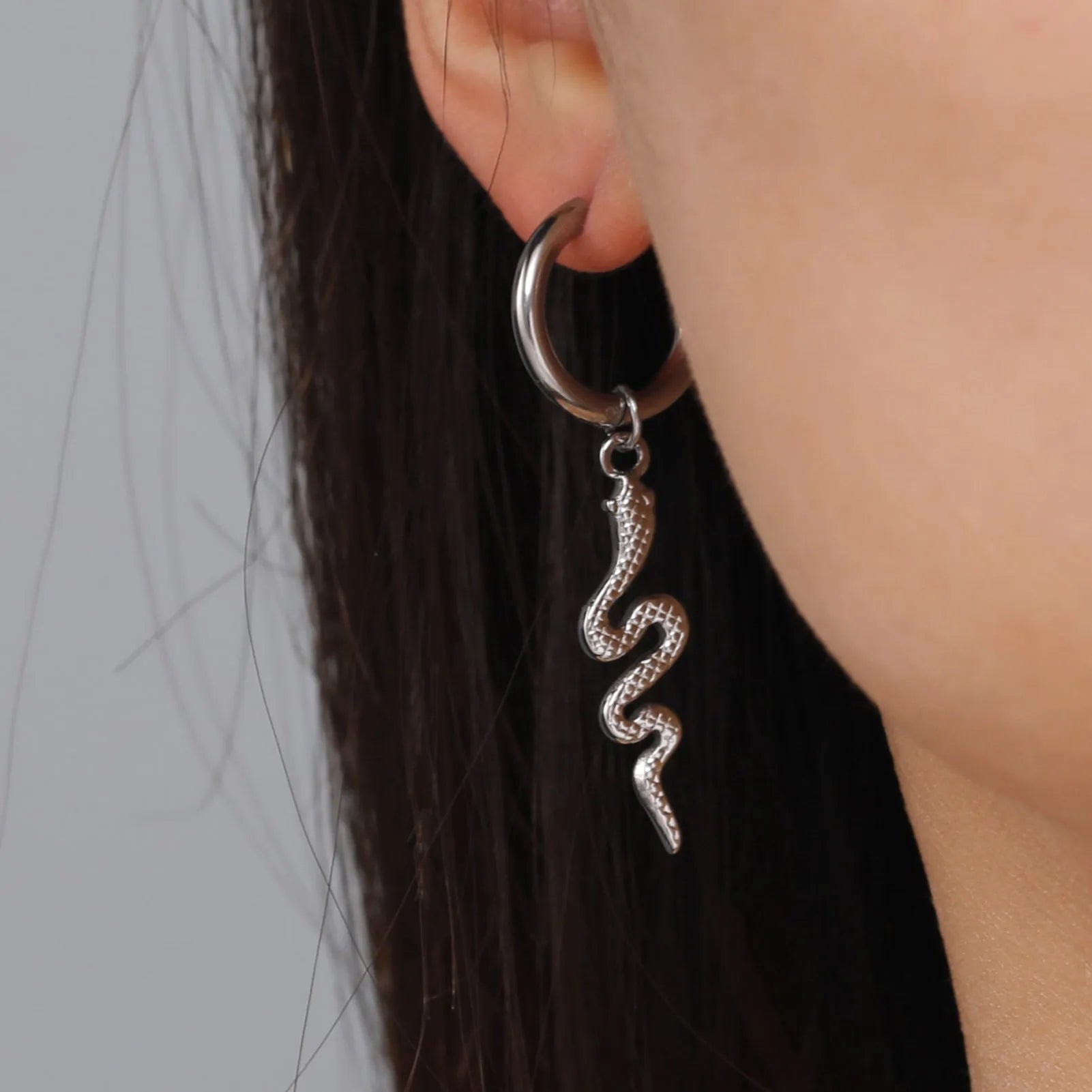 Stainless steel snake earrings with gold electroplating and vintage clip design