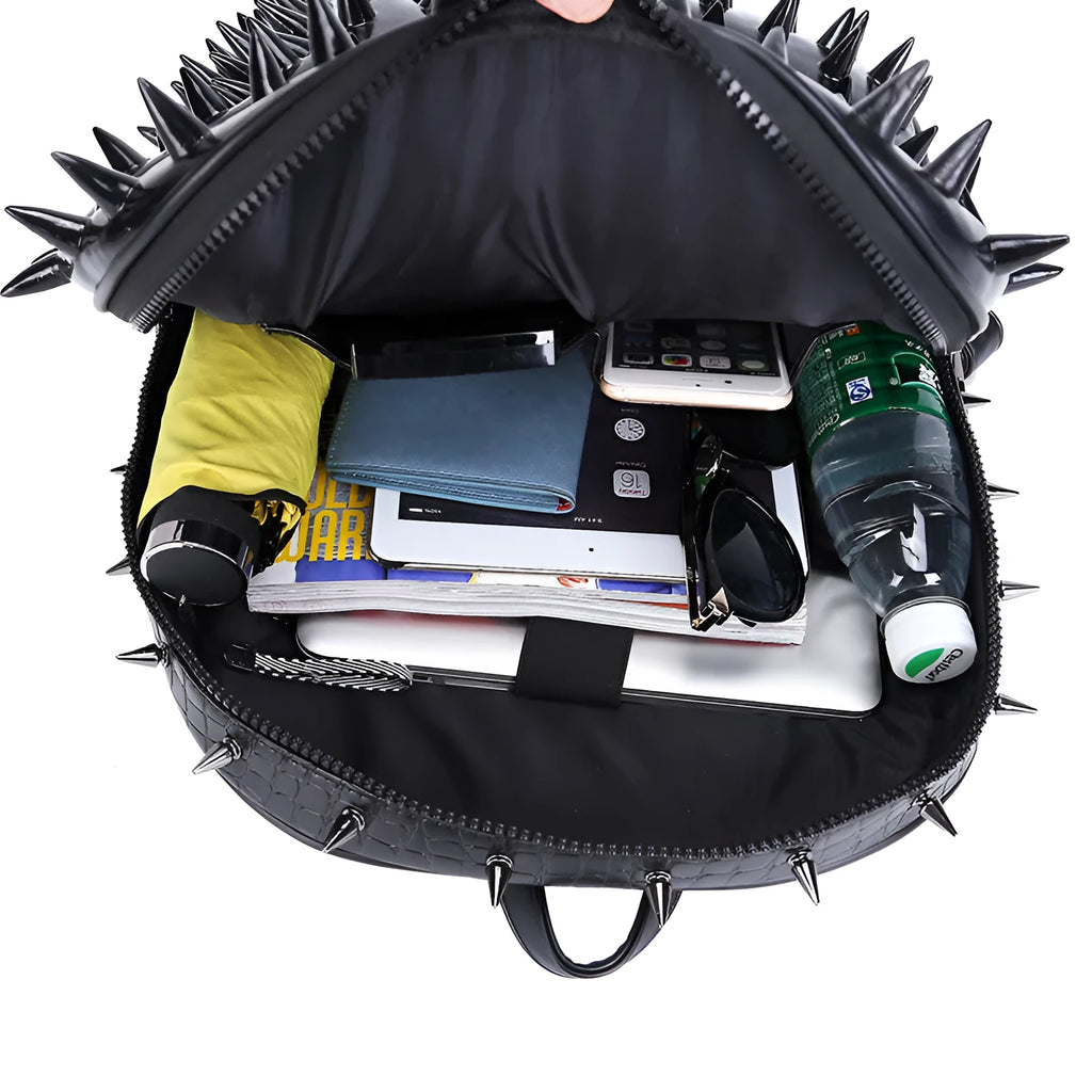 Black oval punk style backpack made of PU leather with silver zippers and air cushion shoulder straps.