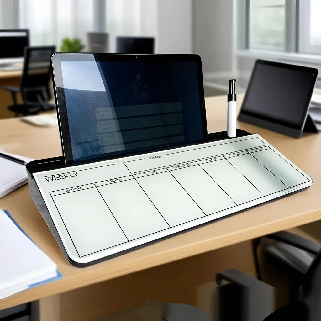 Glass whiteboard 18x40cm with black frame and marker on desk
