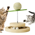Green sisal cat toy with rotating ball track system for indoor feline play