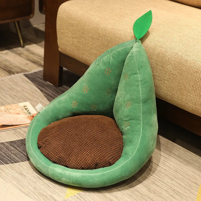 Kawaii plush fruit cushion in avocado colour on a chair, 50x48x45cm, with soft textured cover and non-slip base