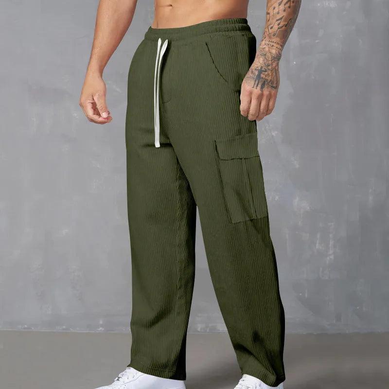 Men's corduroy cargo trousers in navy blue with straight-leg wide-cut design and drawstring waist