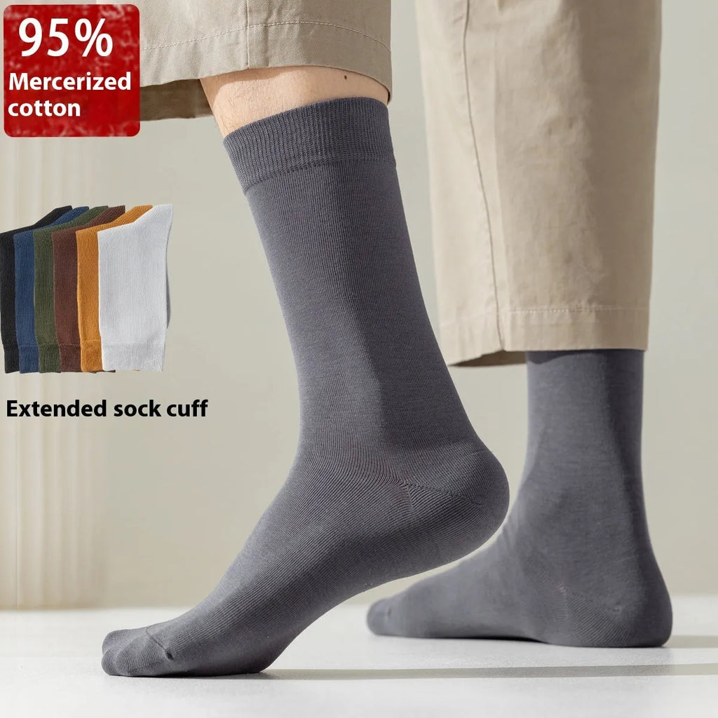 Men's mid-calf length solid colour business socks in combed cotton on a white background.