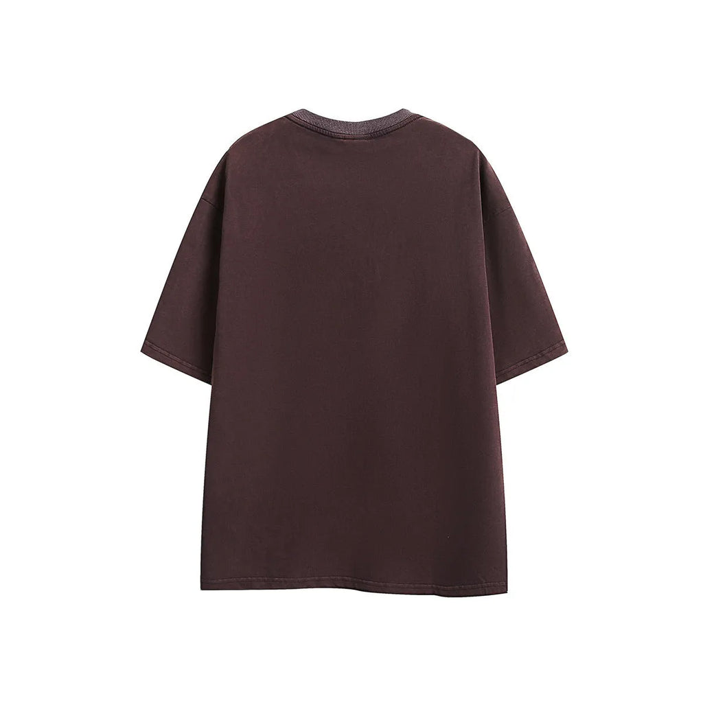 Purple and black washed cotton retro T-shirt with embroidery, shown in loose fit with half-length sleeves.