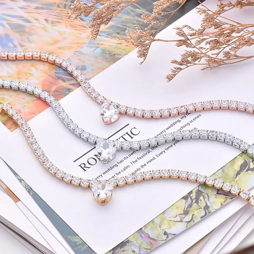 Gold rhinestone heart-shaped collar for dogs and cats on an extension chain.