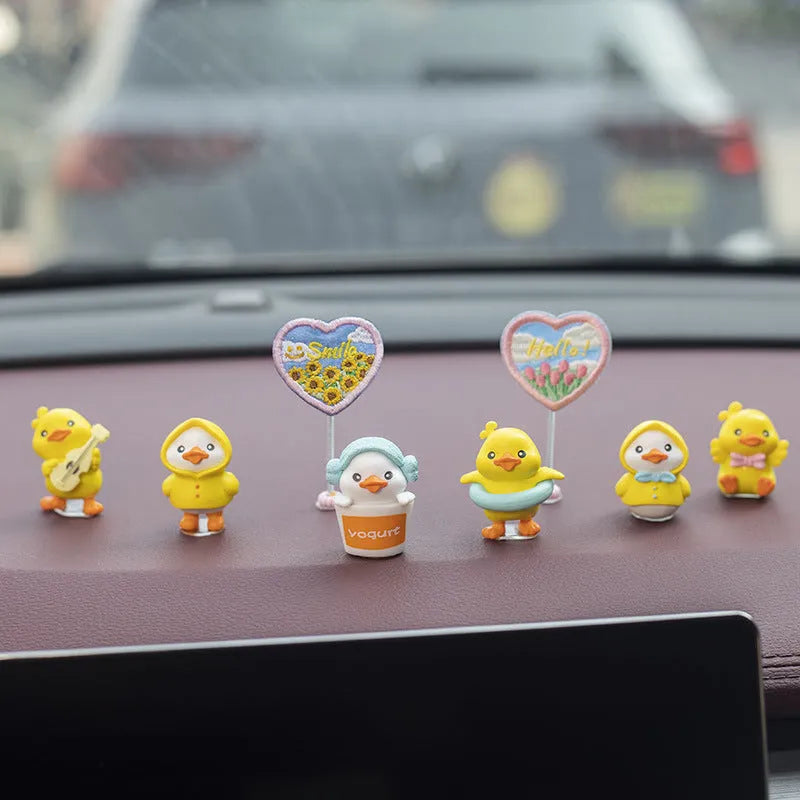 Yellow and white PVC cartoon duckling car decoration set with six small ducks and one welcome sign