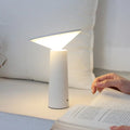 Black or white USB rechargeable LED desk lamp with touch sensor and adjustable lamp head.