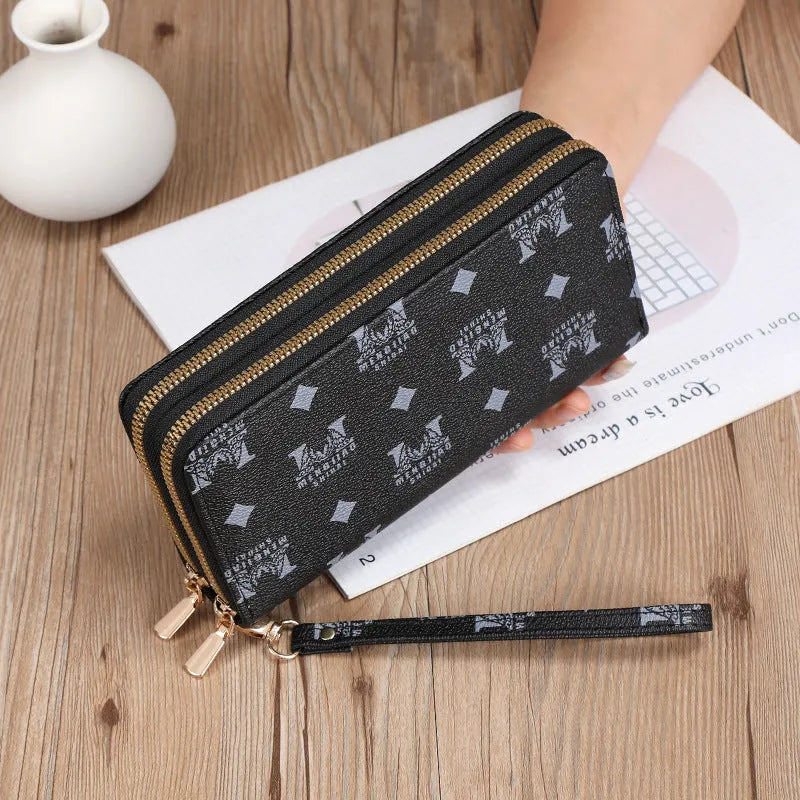 Long PU leather wallet clutch with zip closure and retro print decoration showing internal compartments