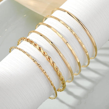 Stylish Bohemian chain bracelets in a gold tone color with geometric shapes, perfect for fashion-forward women