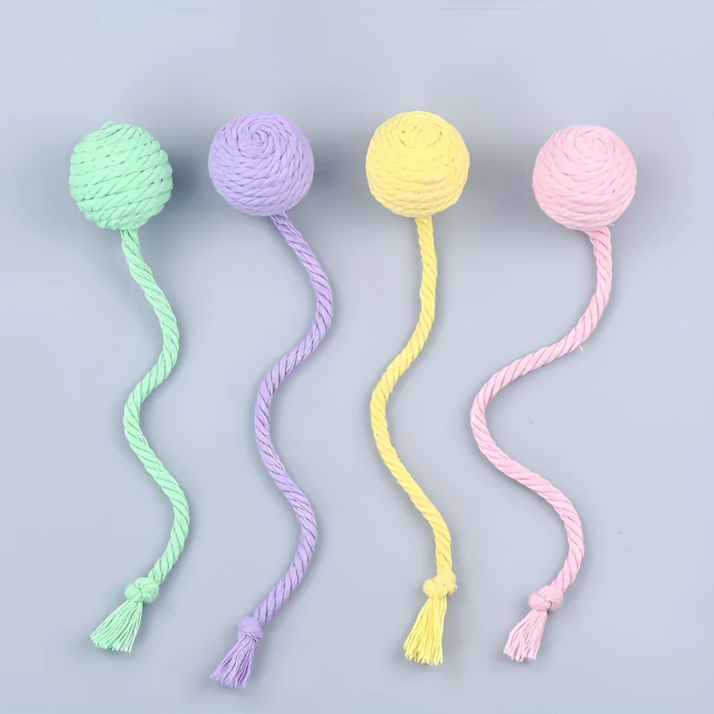 Colourful cat toy ball with attached rope and internal bell for kitten play