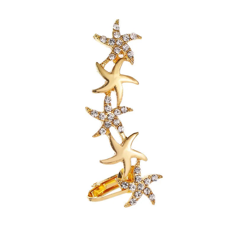 Full crystal butterfly and flower single crystal ear clip in gold alloy finish with artificial gemstone inlay