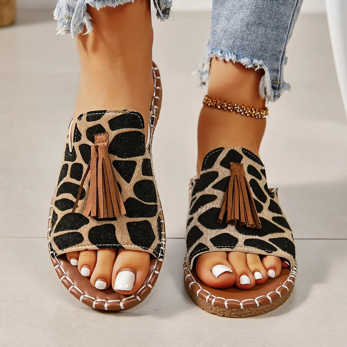 Women's tassel flat sandals in first layer cowhide with grape particle accents, Roman style, fish mouth toe, available in multiple colours