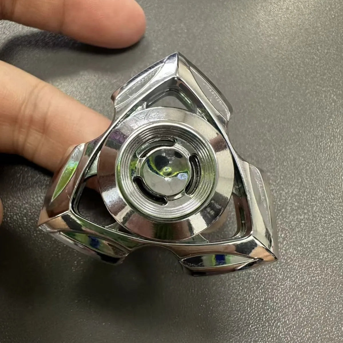 Alloy metal fingertip gyro decompression toy in colourful and silver options for youth ages 15-35