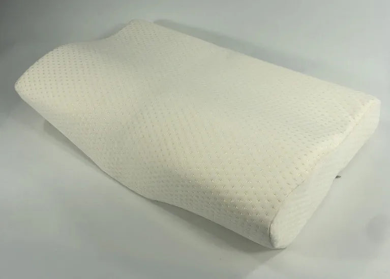 Blue butterfly-shaped memory foam cervical pillow on a bed.