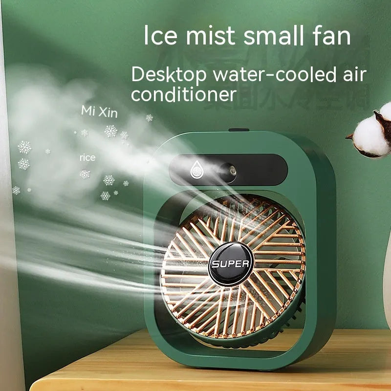 Green and white USB portable misting fan humidifier on a desk showing adjustable vent and water tank.