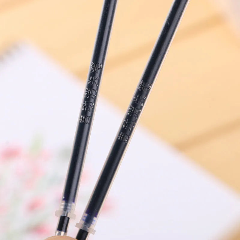 Automatic fade and disappear pen set with pen holder, case, and eight refills for temporary writing.