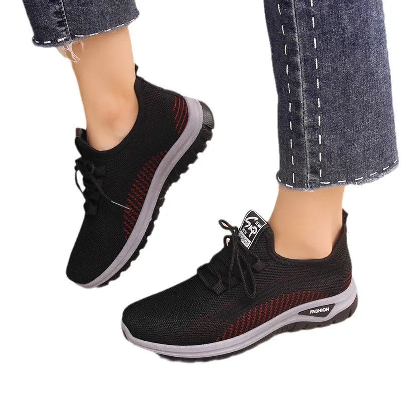 Women's round toe casual sneakers in black with breathable mesh and lace-up front