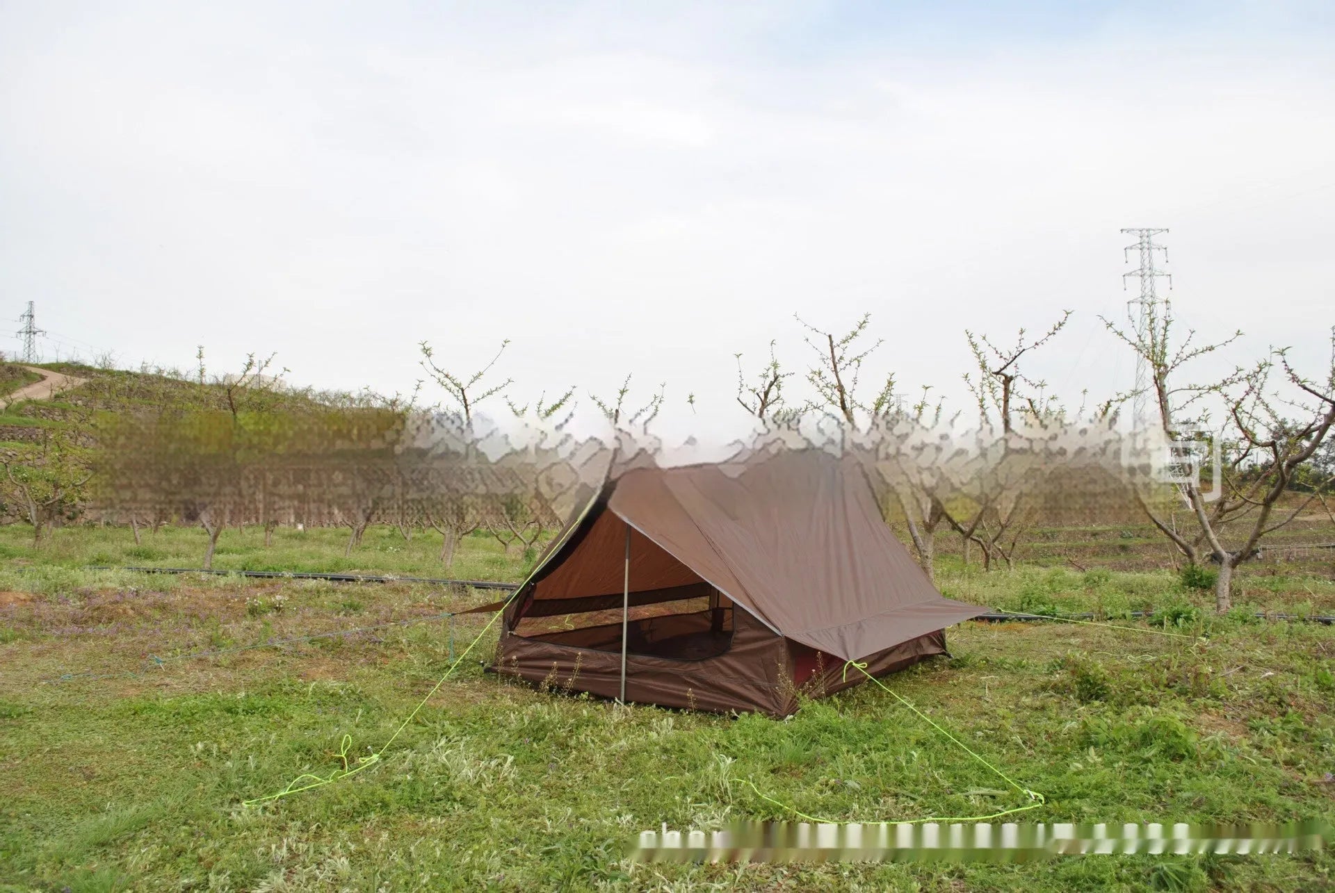 Brown or white A-line pole-free cabin tent for 2-3 people with hiking cane setup.