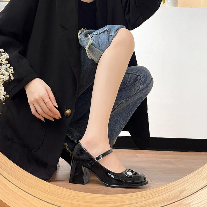 Women's black patent leather chunky heel shoes with round toe and buckle closure for wide feet