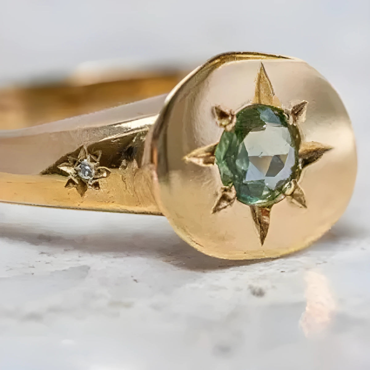 Golden adjustable ring with oval star shape and zircon micro inlay detail.