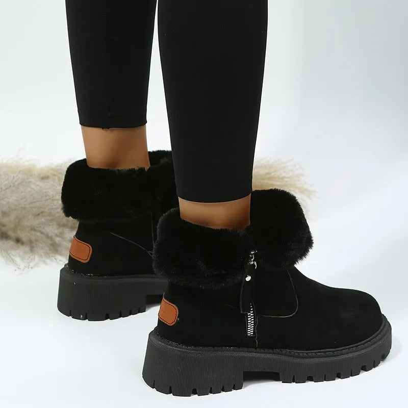 Women's black high-top snow boot with side zip, faux fur lining visible, and a rubber sole.