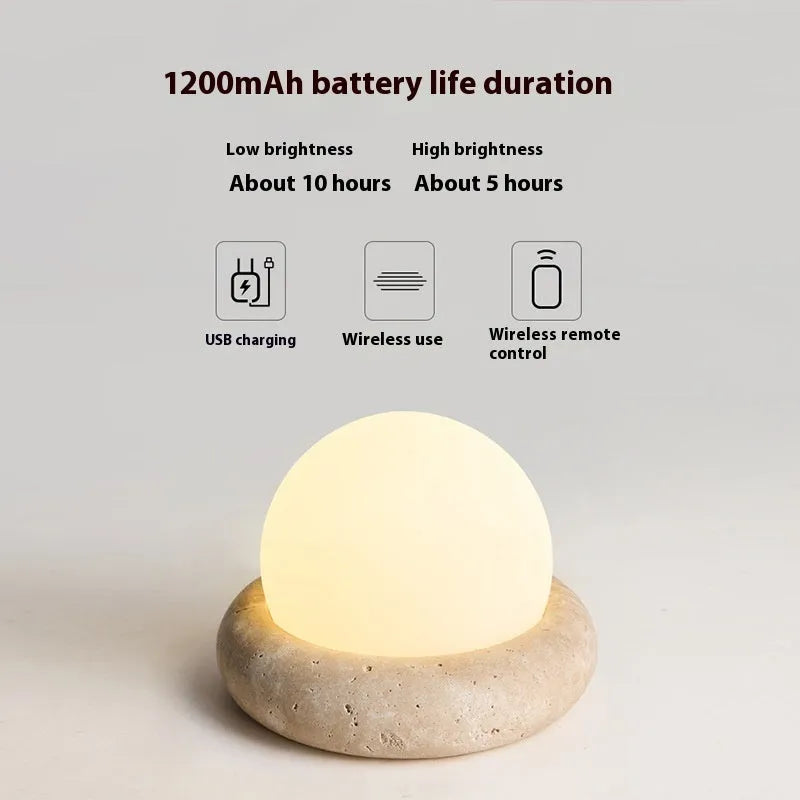 Cream remote control rechargeable bedside lamp with yellow cave stone glow