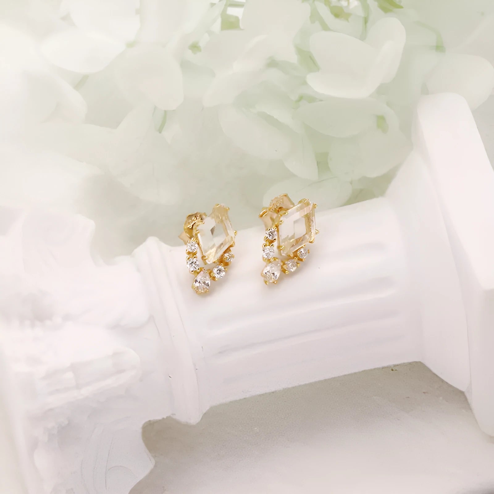 Geometric silver earrings with natural white crystal studs