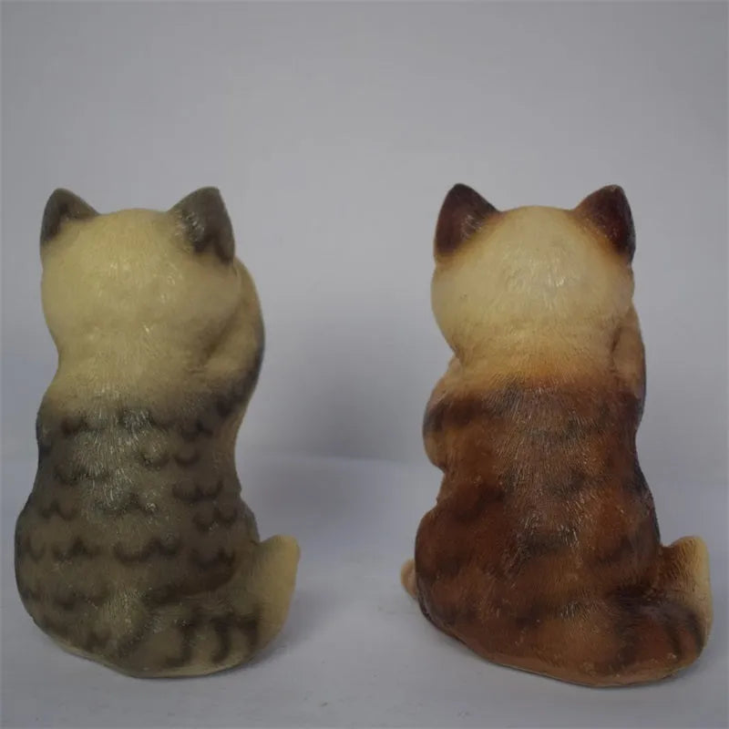 Brown resin cat-shaped solar garden light for outdoor decorative lighting.