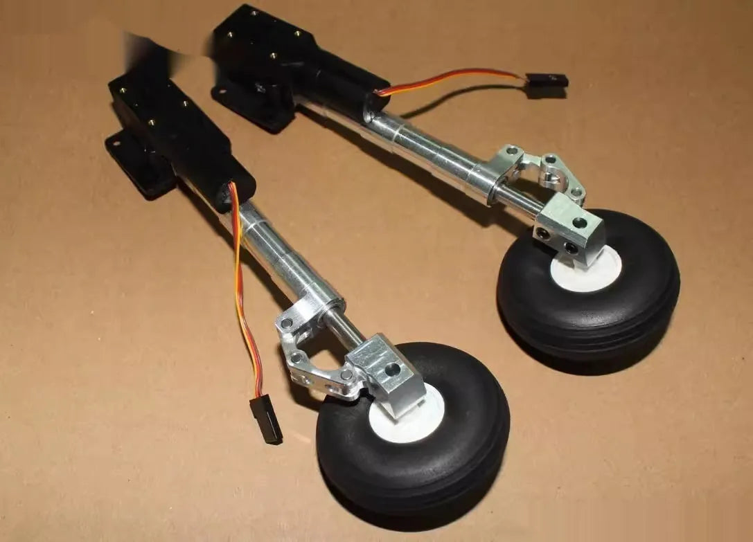 Alloy shock-absorbing retractable landing gear for a drone with alloy wheels.