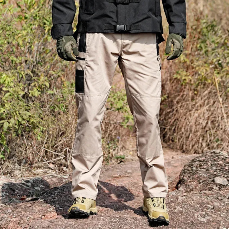 Multi-pocket water repellent outdoor pants in polyester cotton blend, available in five colours, sizes S to XXXL