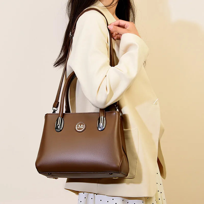 PU crossbody handbag with single strap, zipper compartments, and three-dimensional pocket in black, khaki, brown, green, or blue.