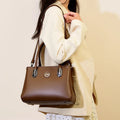 PU crossbody handbag with single strap, zipper compartments, and three-dimensional pocket in black, khaki, brown, green, or blue.