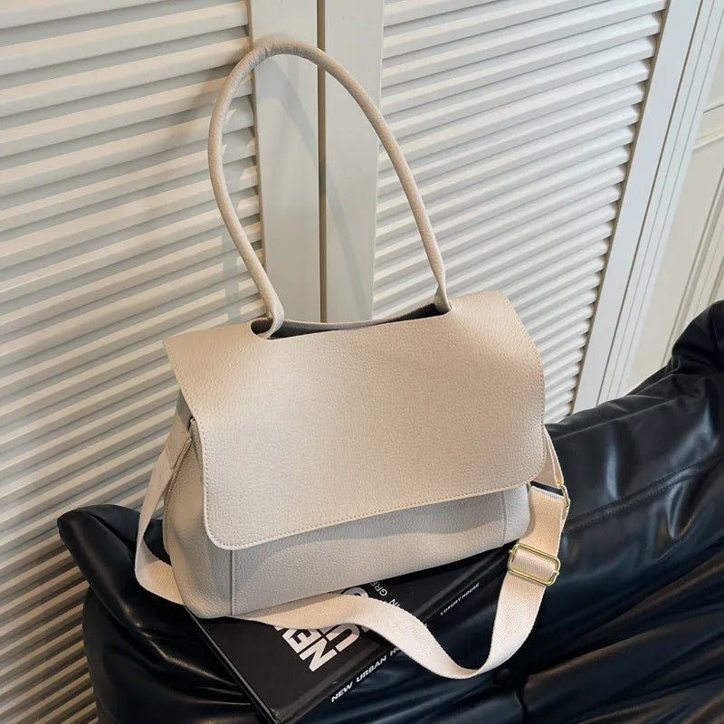 Vintage style square tote bag in PU leather-look material with visible stitching detail.