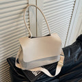Vintage style square tote bag in PU leather-look material with visible stitching detail.