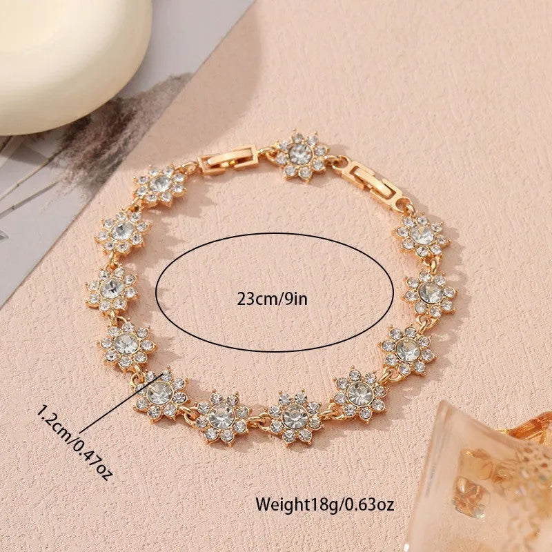 Luxury style bracelet with coloured gems and floral design on zinc alloy with electroplated finish