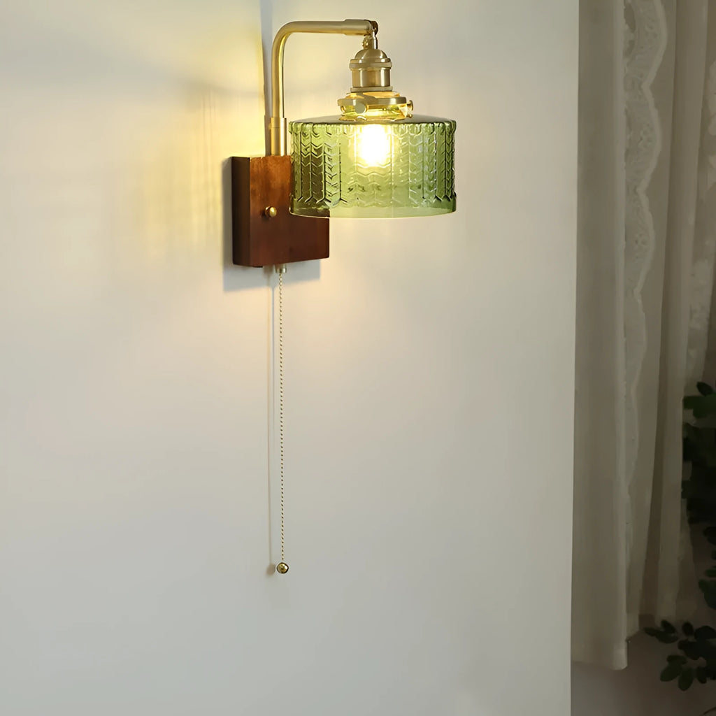 American retro wall lamp with walnut glass brass construction, green glass shade, installed on living room wall