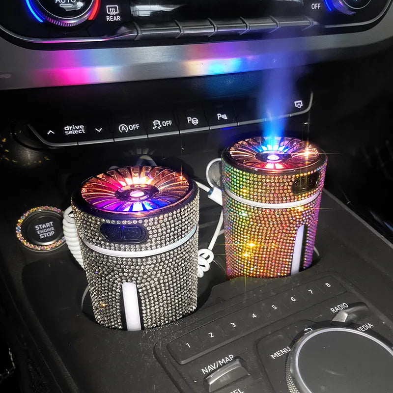Rhinestone-decorated USB car humidifier with LED lights on a dark background.