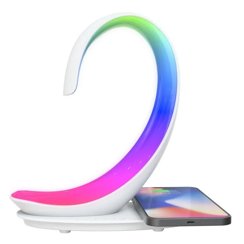 White swan decorative light with wireless charging pad and Bluetooth speaker emitting colourful illumination