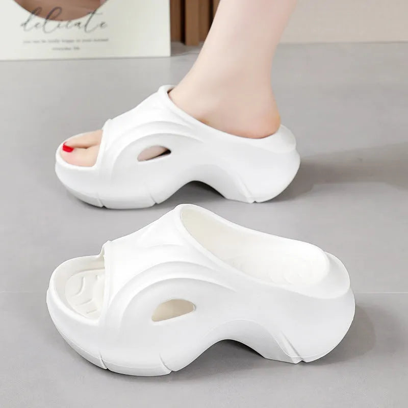 Women's thick-soled EVA beach slippers in white, black, and rose red colours with round toe design