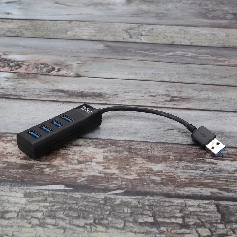 Black USB 3.0 hub with 4 ports, a 30cm cable, and LED activity indicators.