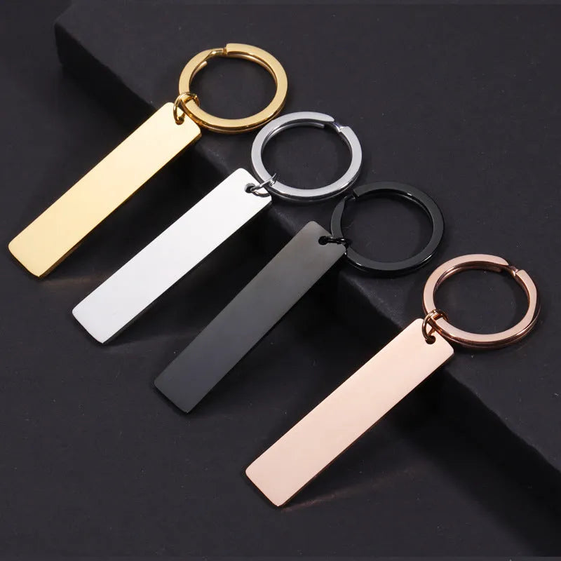 Custom laser engraved Spotify scan code keychain in stainless steel with metal keyring, rectangular pendant, unisex design, black colour