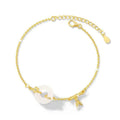Gold tone women's bracelet with white chalcedony stone and adjustable peace symbol buckle closure
