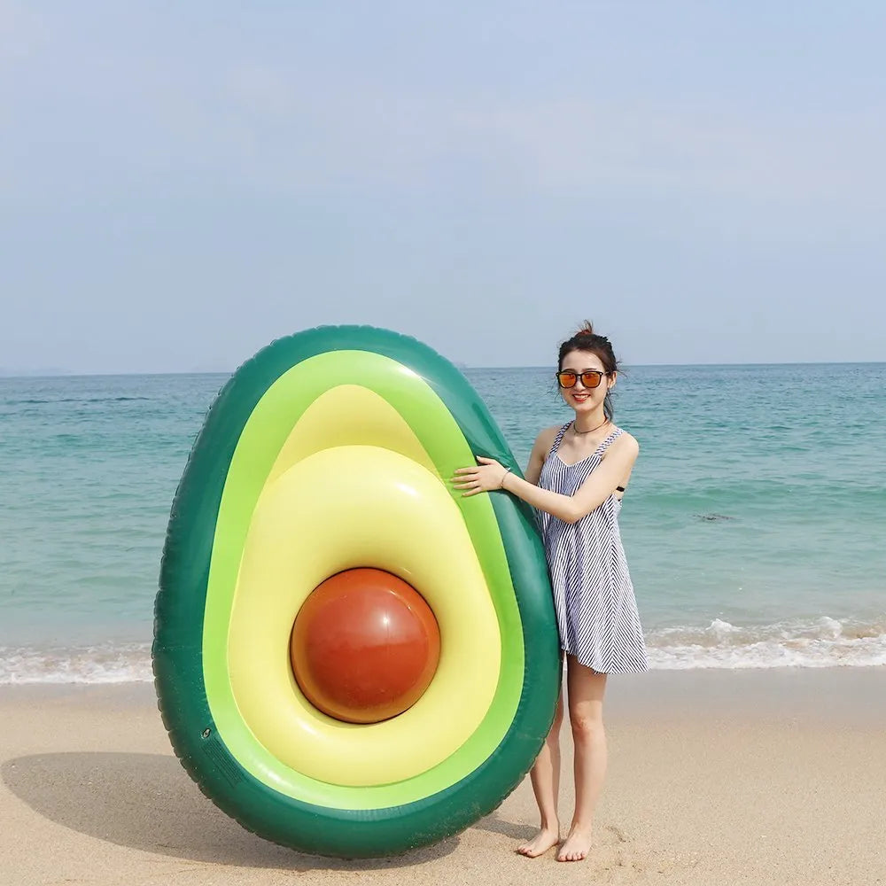Green avocado-shaped inflatable pool float with dimensions 169cm by 130cm.