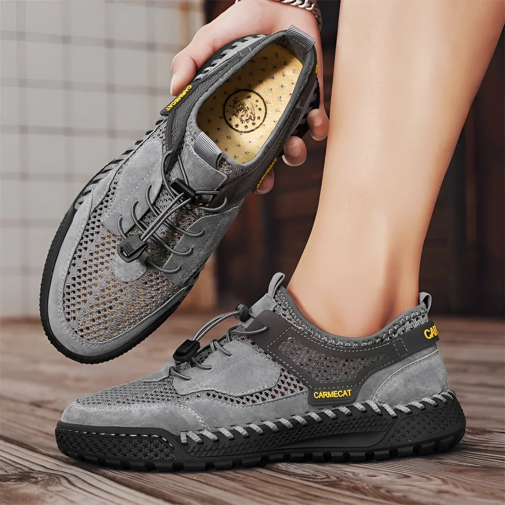 Men's brown suede tennis shoes with elastic closure and hand-stitched rubber soles